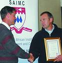 Johan van Jaarsveldt (left) handing Dave Wibberley a memento for sponsoring the July meeting